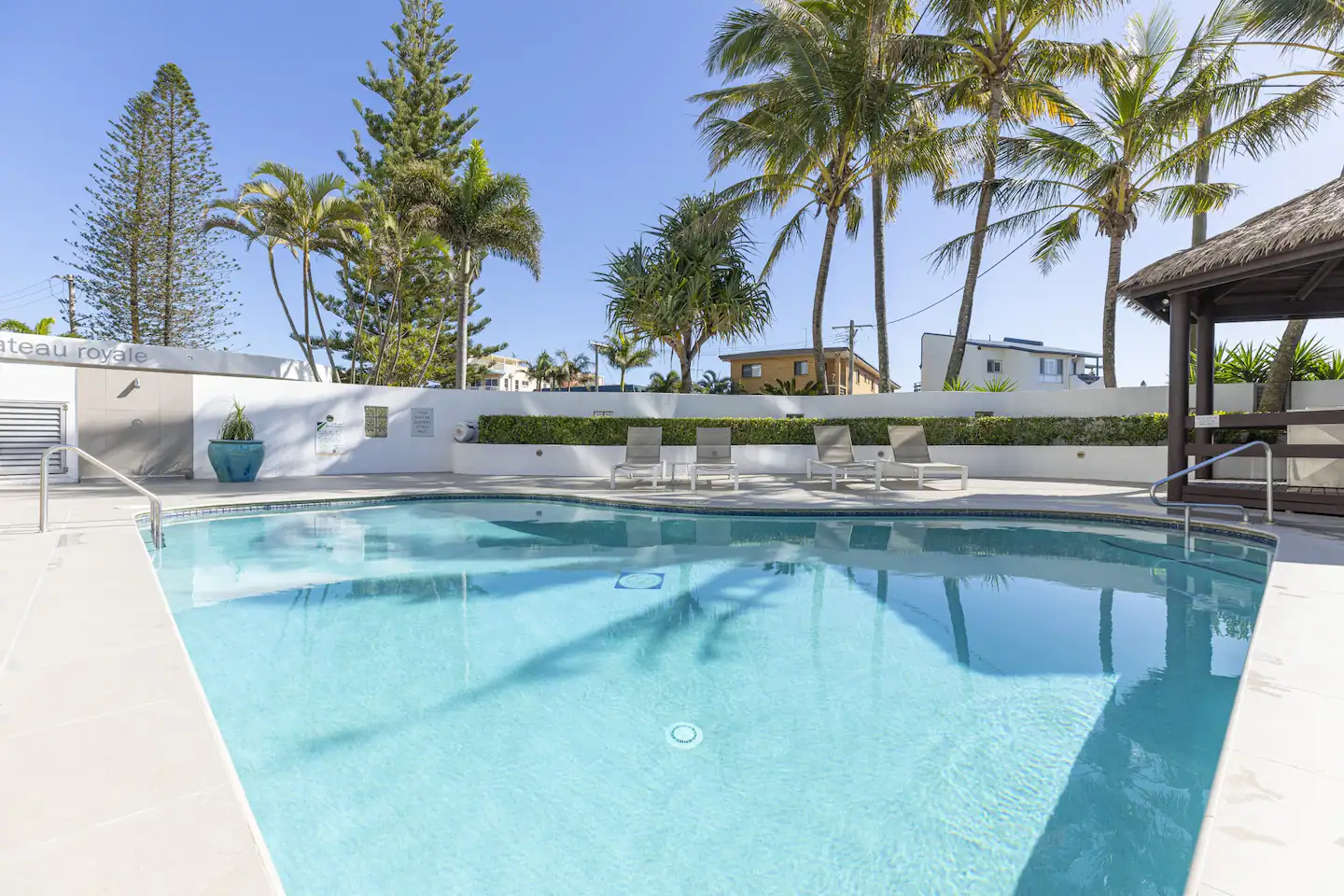 Resort pool with palm trees at Chateau Royale, Cotton Tree Maroochydore Sunshine Coast